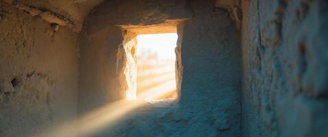 Light Streaming Through a Stone Window, Creating a Warm and Serene Atmosphere photo