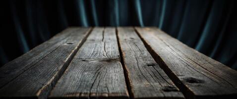 Rustic Wooden Tabletop Against a Dark Blue Curtained Background, Great for Mockups. photo