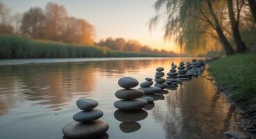 Balanced Stone Stacks Reflecting in Calm River Water at Sunset, Peaceful Scenery. photo