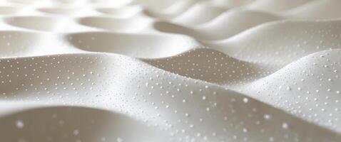 A close up of a white sheet with water droplets photo