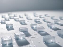 A group of ice cubes on a white surface photo