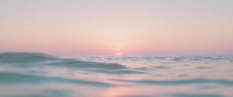 The sun is setting over the ocean photo