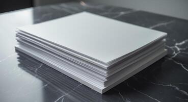 Stack of blank paper on a marble table photo