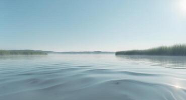A lake with grass and water in the background photo