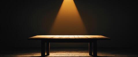 An empty table in a dark room with a spotlight shining on it photo