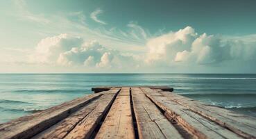 Wooden Pier Leading to Calm Ocean Under a Cloudy Sky Peaceful Coastal View photo