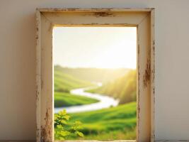 An open window with a view of a green field photo