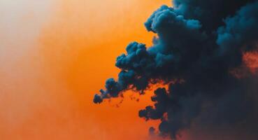 Dramatic Sky. Contrasting Colors of Dark Cloud Formation Against a Vibrant Orange Sky. photo