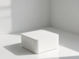 A white cube sitting on a table in a room photo