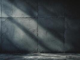 An empty room with a concrete wall and a light coming in photo