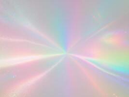 A rainbow colored background with a bright light photo