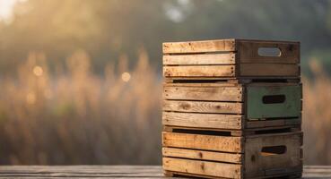 Stack of Three Wooden Crates on a Wooden Surface with a Blurry Background. photo