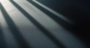 A shadow of a person standing in front of a wall photo