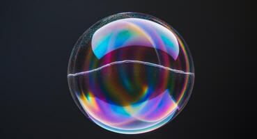 A soap bubble with a rainbow colored reflection photo