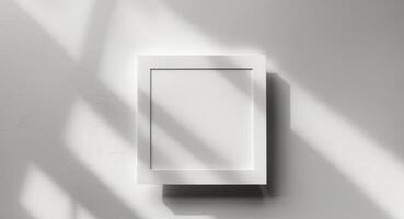White box on a wall with shadow photo