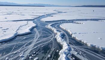 sheets of ice crack and drift slowly across a frozen bay. photo