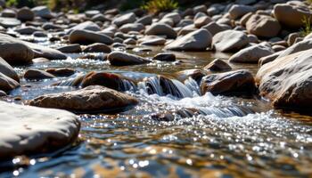 a clear mountain stream tumbles over polished stones in rhythmic cascades. photo