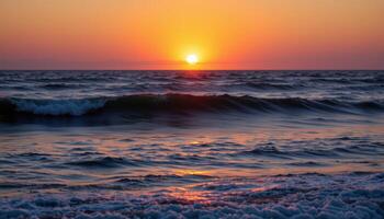 the sun dips below the horizon, casting the ocean in hues of violet and gold. photo