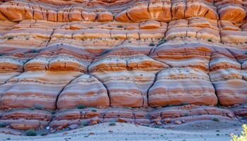 layers of colored rock tell stories of time across an arid desert cliff. photo