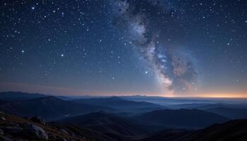a series of hills recedes into the distance under a sky filled with stars. photo