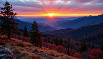 the horizon burns orange and pink as dawn breaks over the hills. photo