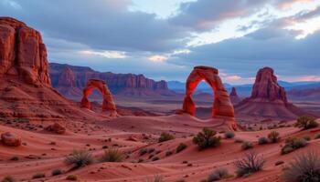 a surreal desert landscape filled with sandstone arches and pillars glowing red. photo