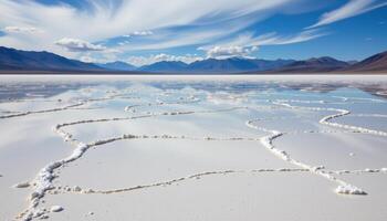 a vast salt flat where the sky reflects perfectly off the mirror like surface. photo
