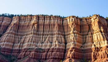 a dramatic cliff face where layers of sedimentary rock create striking patterns under soft light. photo