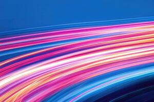 Abstract light trails on a blue background photo