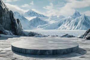 An empty concrete round table in front of a snowy mountain photo