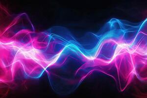 Abstract pink and blue light waves on a black background photo
