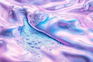 A close up of a liquid with bubbles and pink and blue colors photo