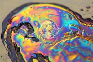 A close up of a colorful liquid with a circle in the middle photo
