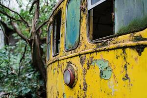 A yellow bus with a broken window photo