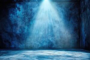 An empty room with a light shining through the ceiling photo