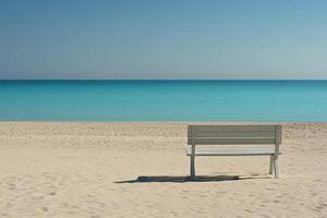 A white bench sitting on a sandy beach photo