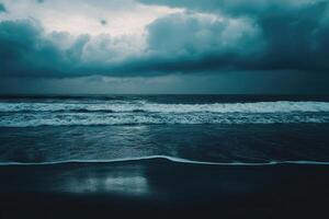 Stormy ocean waves on the beach with dark clouds photo