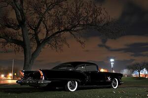 A black car parked on the side of the road photo