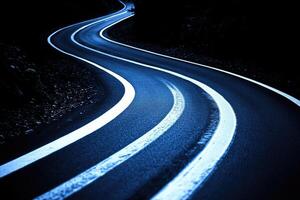 A winding road with white lines photo