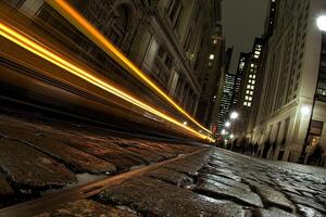 A long exposure photograph of a city street at night photo