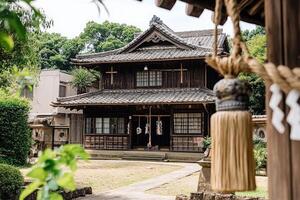 Traditional Japanese temple. Wooden structure, tiled roof, serene garden photo