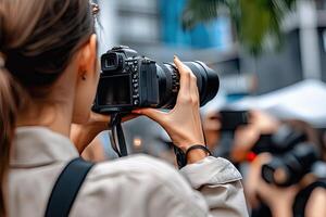 Woman photographer capturing city street scene photo