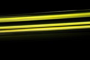 A yellow and black background with a long streak of light photo