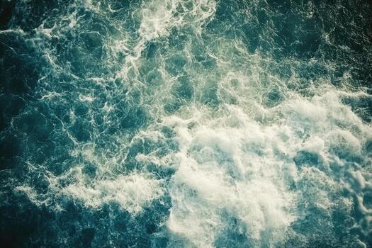 An aerial view of the ocean with waves photo