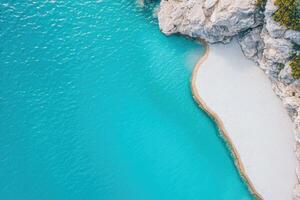 Aerial view of the turquoise sea and white sand beach in the mediterranean sea photo