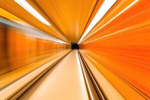 A train moving through a tunnel with a blurry image photo