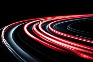 A long exposure photograph of a car driving on a road photo