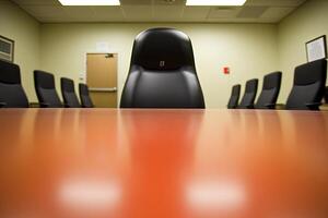 A conference room with a chair and a table photo