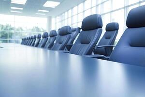 A conference table with blue leather chairs photo