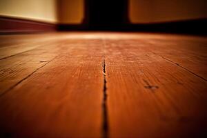 An empty wooden floor with a dark hallway photo